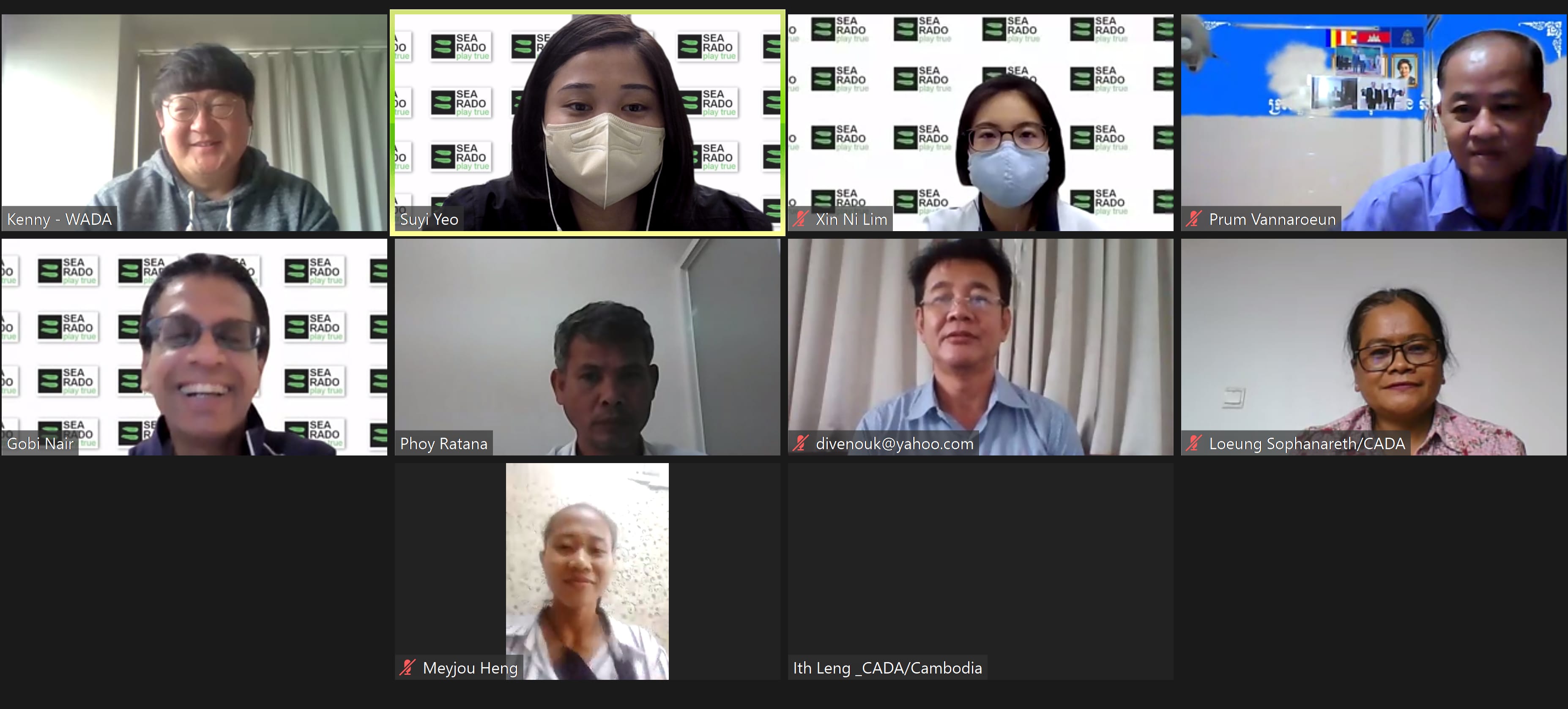 Nine participants in a video call, some wearing face masks, with name labels and SEA RADO branded backgrounds visible.